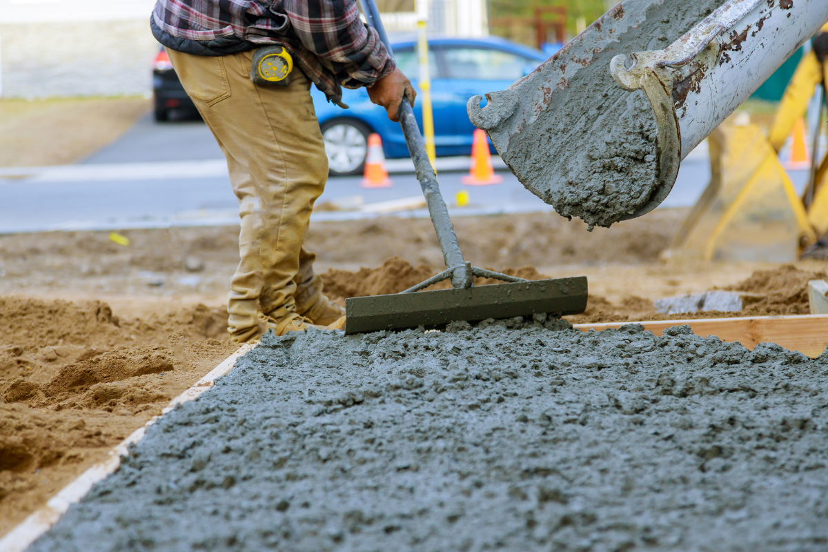 Man pouring concrete mix using a pump